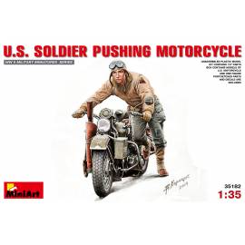 U.S.  SOLDIER PUSHING MOTORCYCLE